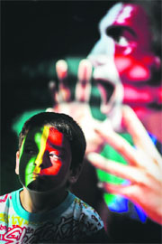 A young Portuguese fan gets his face painted in the colors of the national flag, at Parque das Nacoes in Lisbon moments before the match between Portugal and Netherlands at the Metalist stadium in Kharkiv on Sunday. 