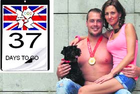 Hungarian water polo player Gabor Kiss, Olympic champion (2008), poses with his fiancee Dora and their dog in Budapest