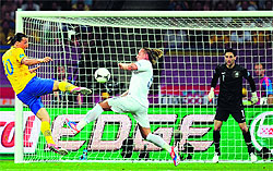 Swedish forward Zlatan Ibrahimovic (L) shoots to score during their match against France at the Olympic Stadium in Kiev on Tuesday. Sweden won 2-0