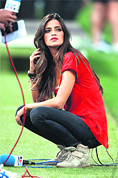 Spanish TV presenter Sara Carbonero, partner of Spain goalkeeper Iker Casillas, follows the quarterfinal match between Spain and France in Donetsk