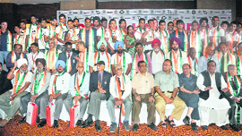 Sports Minister Lalit Maken and other officials pose with the great hockey Olympians from the past, all of them medal winners at the Olympics, at a felicitiation ceremony in New Delhi.