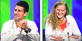 Defending champions Novak Djokovic and Petra Kvitova smile during a press conference on the eve of the start of the Wimbledon.
