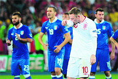 Wayne Rooney (R) reacts after England lost to Italy on penalties in the quartefinals.