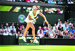 Petra Kvitova serves during her match against Akgul Amanmuradova at the All England Tennis Club in Wimbledon on Tuesday.