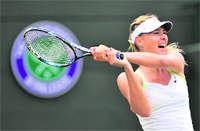Maria Sharapova hits a backhand during her win over Tsvetana Pironkova at the All England Tennis Club in Wimbledon on Thursday. � AFP 