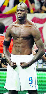 Italy's Mario Balotelli celebrates his second goal during their semifinal against Germany at the National Stadium in Warsaw on Thursday. Italy won 2-1