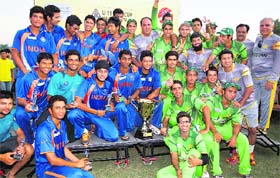 SHARING HONOURS: The Indian and Pakistani teams pose with the trophy after the final of the under-19 Asia Cup ended with the scores tied on 282 runs in Kuala Lumpur on Sunday