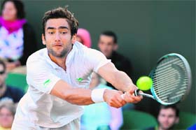 Croatia's Marin Cilic plays a double-handed backhand shot during his third-round victory over Sam Querrey of the US on Saturday