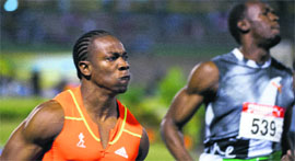 Yohan Blake wheels away after beating Usain Bolt (R) during the Jamaican Olympic trials.