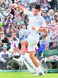 Novak Djokovic of Serbia celebrates his win over Germany's Florian Mayer in the quarterfinals
