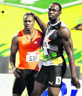 Perhaps young challenger Yohan Blake (L) would spur Usain Bolt to lower the world record again. 