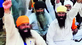 Members of Sikh bodies hold a protest.