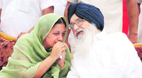 Chief Minister Parkash Singh Badal with SAD-BJP candidate Sukhjit Kaur.