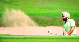 Sujjan Singh of India hits out of the bunker during the third round of the Taman Dayu Championship in Surabaya, Indonesia. 