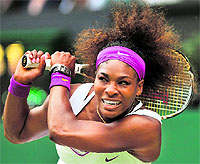 Serena Williams hits a backhand during the women's singles final against Agnieszka Radwanska at the All England Tennis Club in Wimbledon on Saturday. Serena won the final 6-1, 5-7, 6-2 for her fifth Wimbledon title