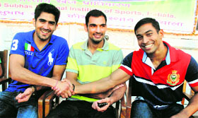 Boxer Vijender Singh, Jai Bhagwan and weightlifter Ravi Kumar during the valedictory party at the NIS Patiala on Monday.