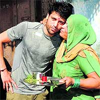 Olympics-bound boxer Sumit Sangwan with his mother before leaving his village Sekhpura in Karnal on Wednesday