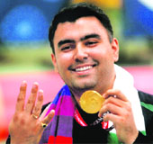 A file photo shows Gagan Narang celebrating his fourth gold medal at the 2010 Commonwealth Games. Narang had won in 10m Air Rifle Individual, 10m Air Rifle (Pairs), 50m Rifle 3 Positions Individual and 50m Rifle 3 Positions (Pairs). 