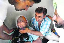 An inconsolable relative of a victim. Tribune photo: Rajesh Sachar