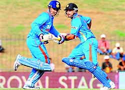 Virat Kohli (R) and Virender Sehwag (L) during the opening ODI at the Suriyawewa Mahinda Rajapakse International Cricket Stadium in Hambantota on Saturday