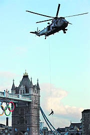 The action film-style descent (top) at the historic Tower of London began symbolically at 20.12 pm (BST), exactly seven days before the July 27 opening ceremony. 