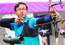 Tarundeep Rai competes during the ranking round of the men's archery individual event at the Lord's Cricket Ground in London on Friday. � AFP 