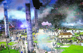 Actors perform around huge chimneys that emerged from the ground to symbolise the industrial revolution during the opening ceremony on Friday.