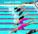 Swimmers dive as they compete in the women's 400m individual medley heats at the Aquatic Centre in London on Saturday.