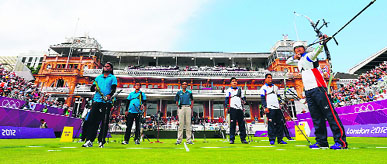 Japan�sTakaharu Furukawa (R) shoots the arrow as he competes in the men's team archery eliminations match against India at the Lord's Cricket Ground in London on Saturday.