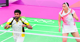 India's V Diju V (L) and Jwala Gutta in action against Indonesia's Lilyana Natsir and Ahmad Tontowi during their mixed doubles group match on Saturday.