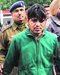 Rahul, accused in the double murder of Sahoos, being produced in court.
