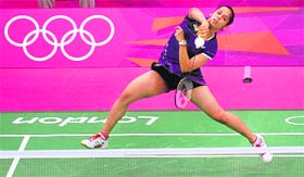 India's Saina Nehwal returns a shot to Swizerland's Sabrina Jaquet in London on Sunday