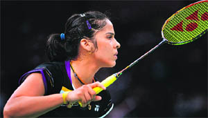 Saina Nehwal prepares to play a shot during her match against Lianne Tan of Belgium on Monday. Saina won 21-4, 21-14. 