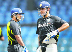 Indian captain MS Dhoni (R) and Virender Sehwag during a net session in Colombo on Monday.