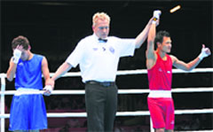 Devendro Singh (R) reacts after defeating Honduras' Bayron Molina Figueroa on Tuesday. � Reuters