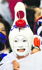 A Japanese fan attends the soccer match against South Africa in Cardiff, on Tuesday. � Reuters