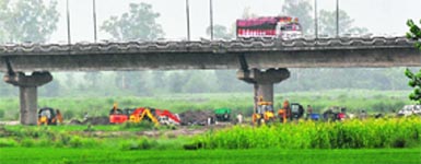 Excavation being carried out illegally under the Khanna-Nawanshahr Sutlej bridge.Tribune Photo: Vicky