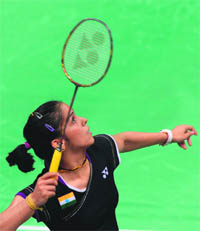Saina Nehwal plays a shot during her quarterfinal women's singles badminton match against Tine Baun of Denmark in London on Thursday. Nehwal won 21-15, 22-20. 