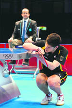 Dimitrij Ovtcharov of Germany serves during his bronze medal singles match on Thursday