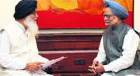 Chief Minister Parkash Singh Badal with Prime Minister Manmohan Singh in New Delhi on Saturday. A Tribune photograph