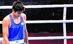 Vijender reacts after losing his quarterfinal bout on Monday night