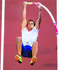 France�s Renaud Lavillene attempts to clear 5.97m during the pole vault final on Friday night