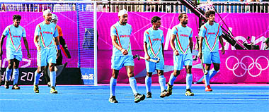 Indian players react after South Africa scored a goal during the 11th-12th position match in London on Saturday