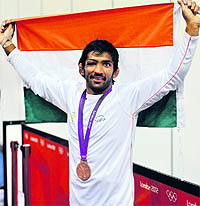 Yogeshwar Dutt poses with the Tricolour after his bronze medal win on Saturday night
