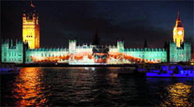An image of a swimmer is displayed on the wall of the Houses of Parliament.