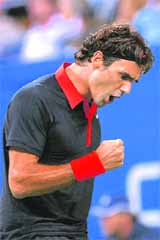 Federer beat Bernard Tomic 6-2 6-4 to move into quarters.