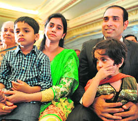 VVS Laxman (R), wife Sailaja and their children Sarvajith and Achinthya attend a press conference held to announce his retirement from Test Cricket in Hyderabad on Saturday. 