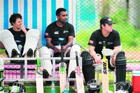 Geared Up: New Zealand�s Doug Bracewell (L), Tarun Nethula (C), and Martin Guptill wait to bat during a net session in Hyderabad on Monday