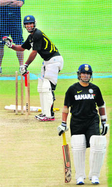 Sachin Tendulkar (R) and Cheteshwar Pujara during a practice session in Hyderabad on Tuesday. 