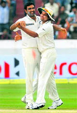R Ashwin (L) is congratulated by Suresh Raina after picking up a wicket in Hyderabad on Saturday.